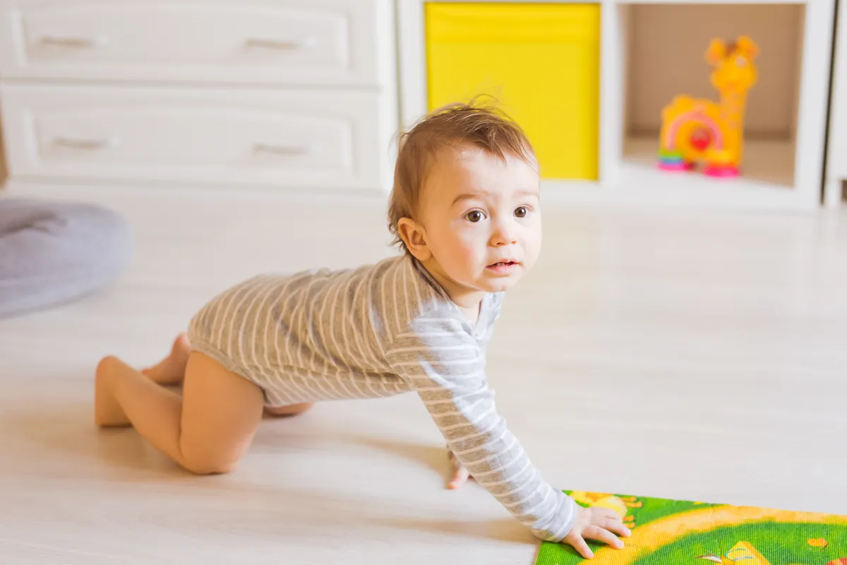 Why is my baby crawling backwards?