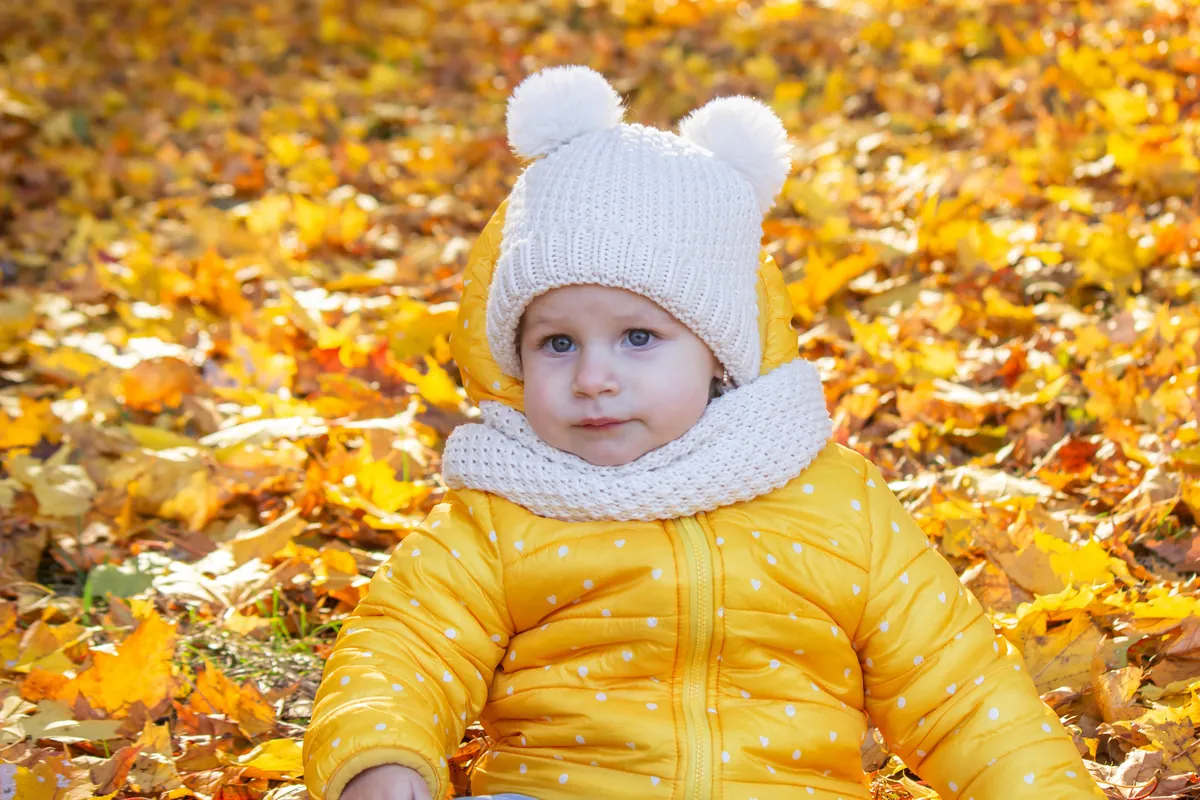 How do I dress my baby for cold or warm weather?