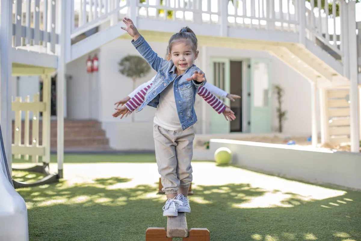 How do children develop their balance?